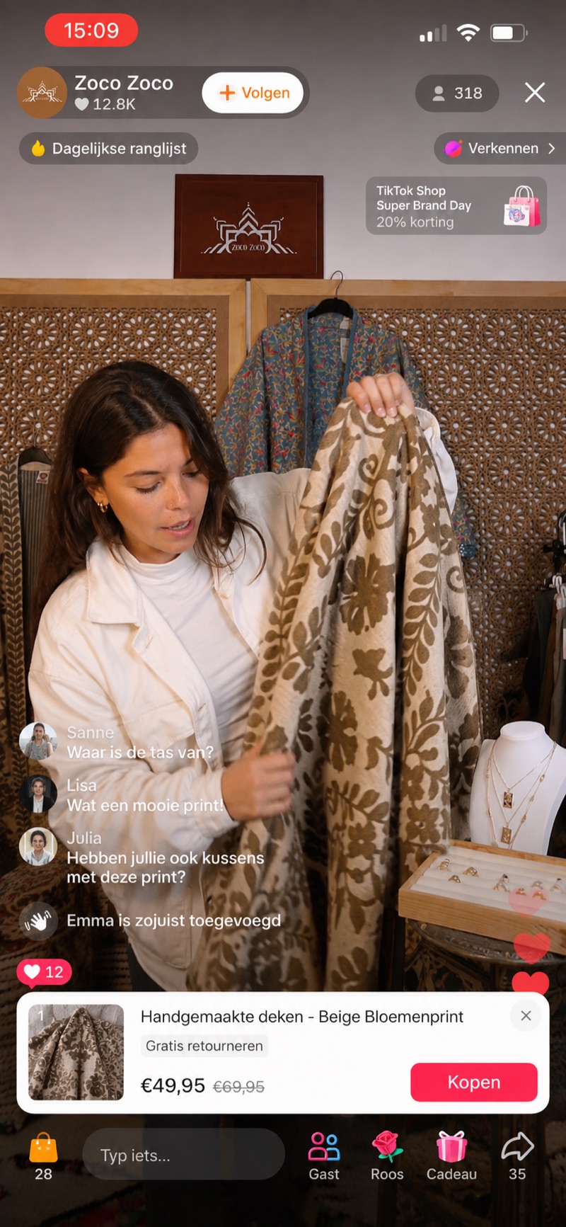 Zoco Zoco LIVE seller unfolding a handmade beige floral print blanket